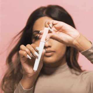 Woman using facial razor